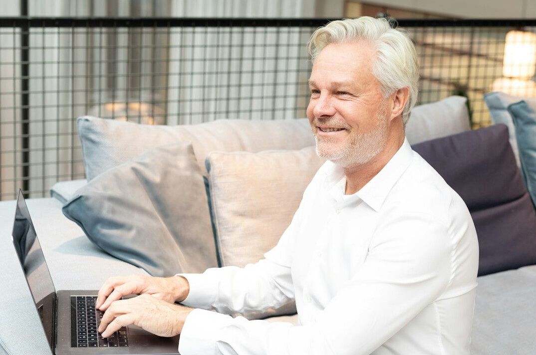 successful older developer smiling